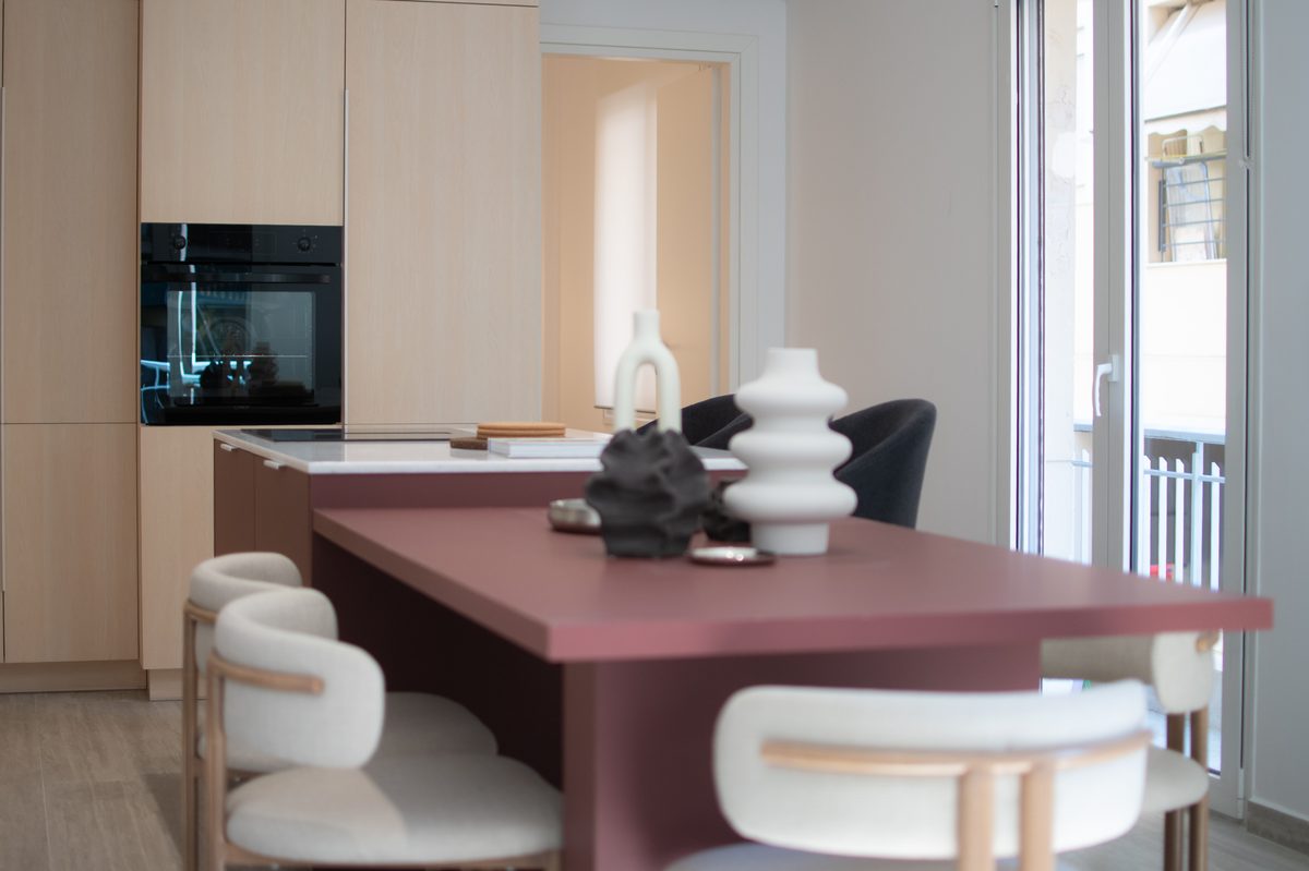 Kitchen with burgundy island and oak cabinetry — Kypseli project