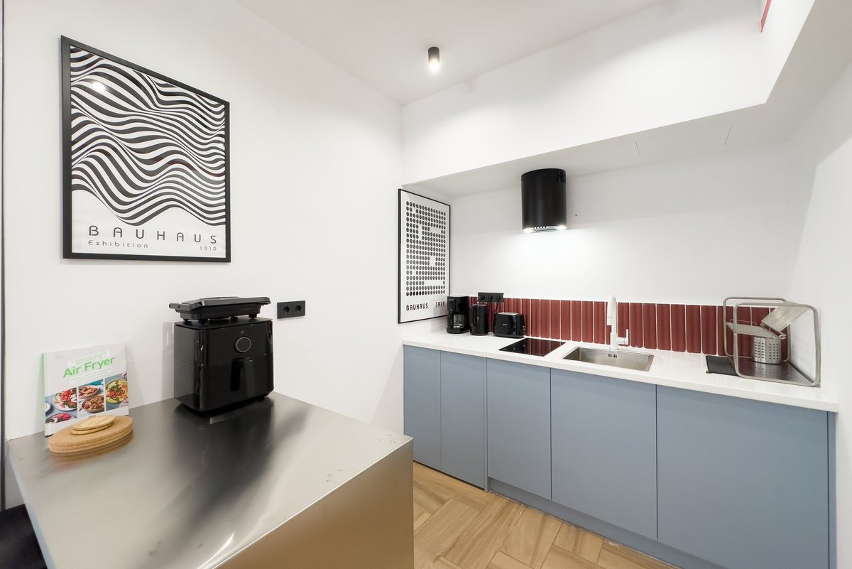 Kitchenette with pale-blue cabinets
