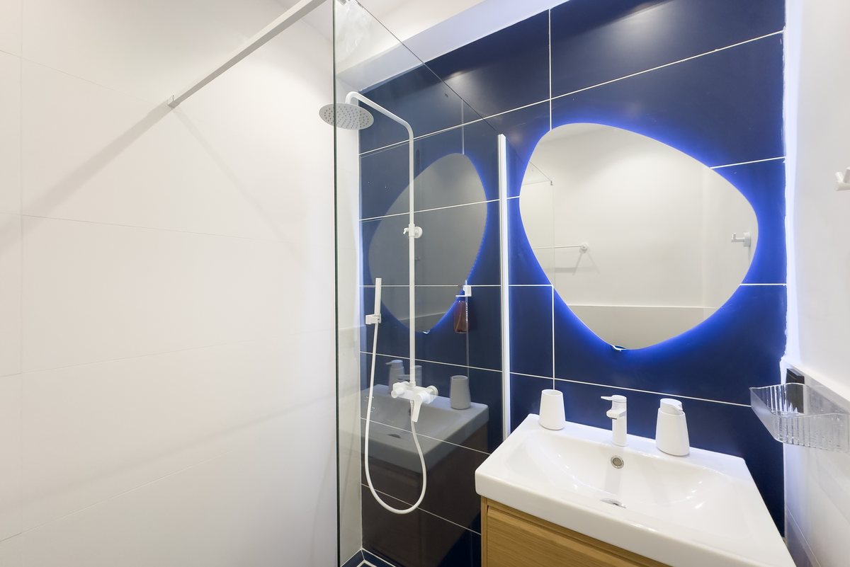 Basin and lit mirror